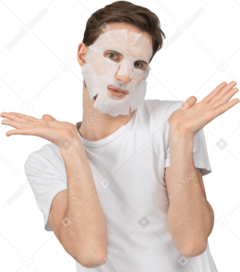 顔のマスクでポーズをとる若い男の正面図