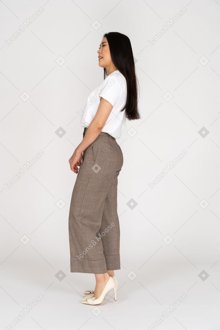 Side view of a sleepy young lady in breeches and t-shirt