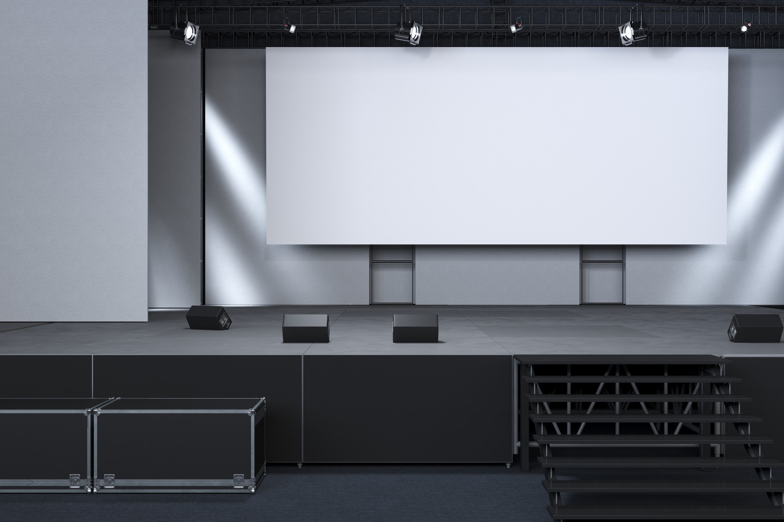 A stage with a big blank screen in an official-looking room