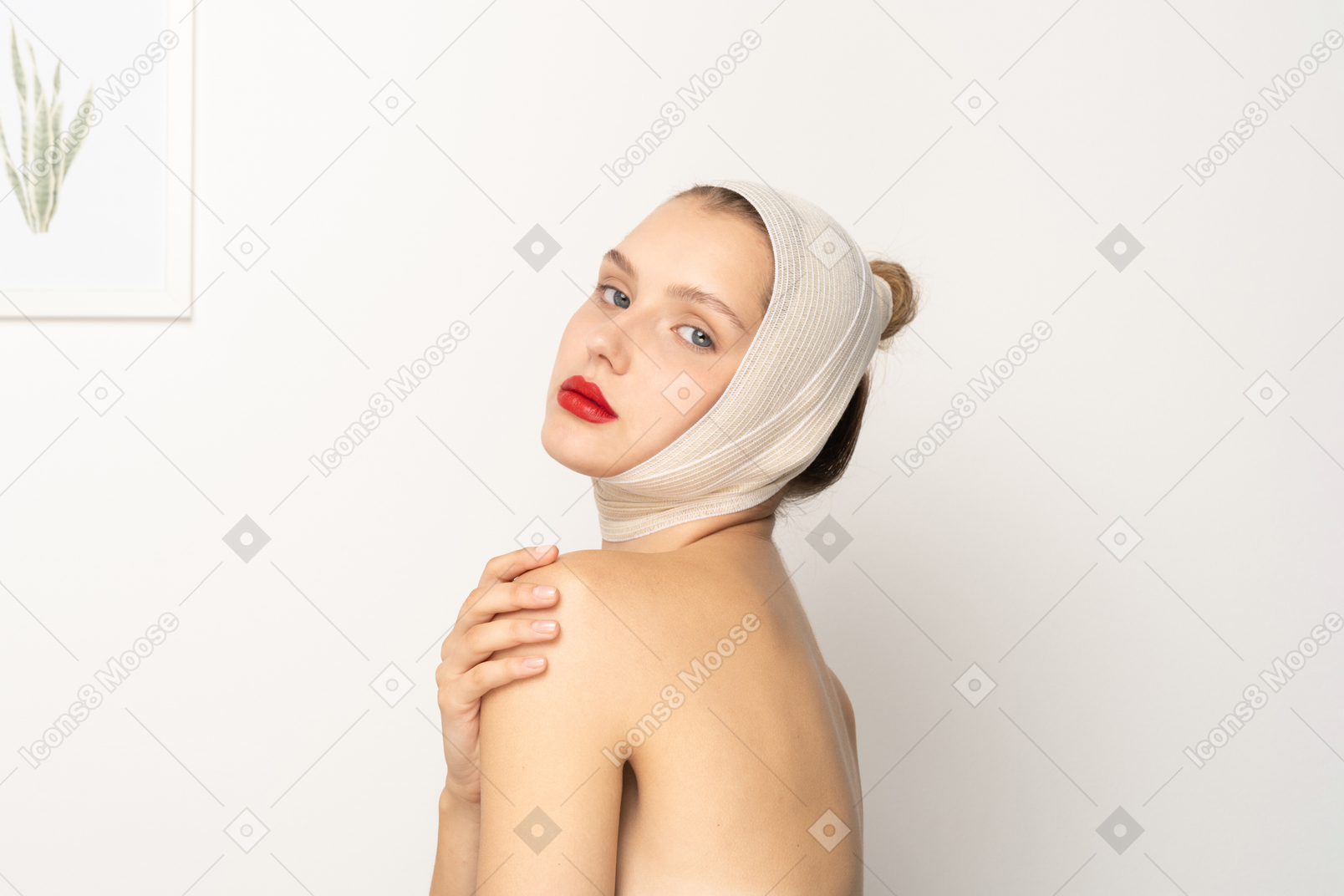 Woman with bandaged head touching her shoulder