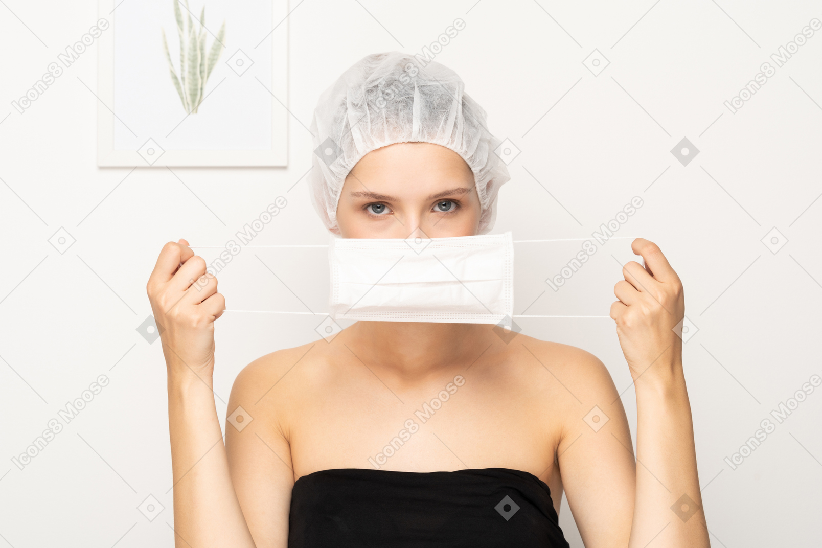 Woman putting on mask