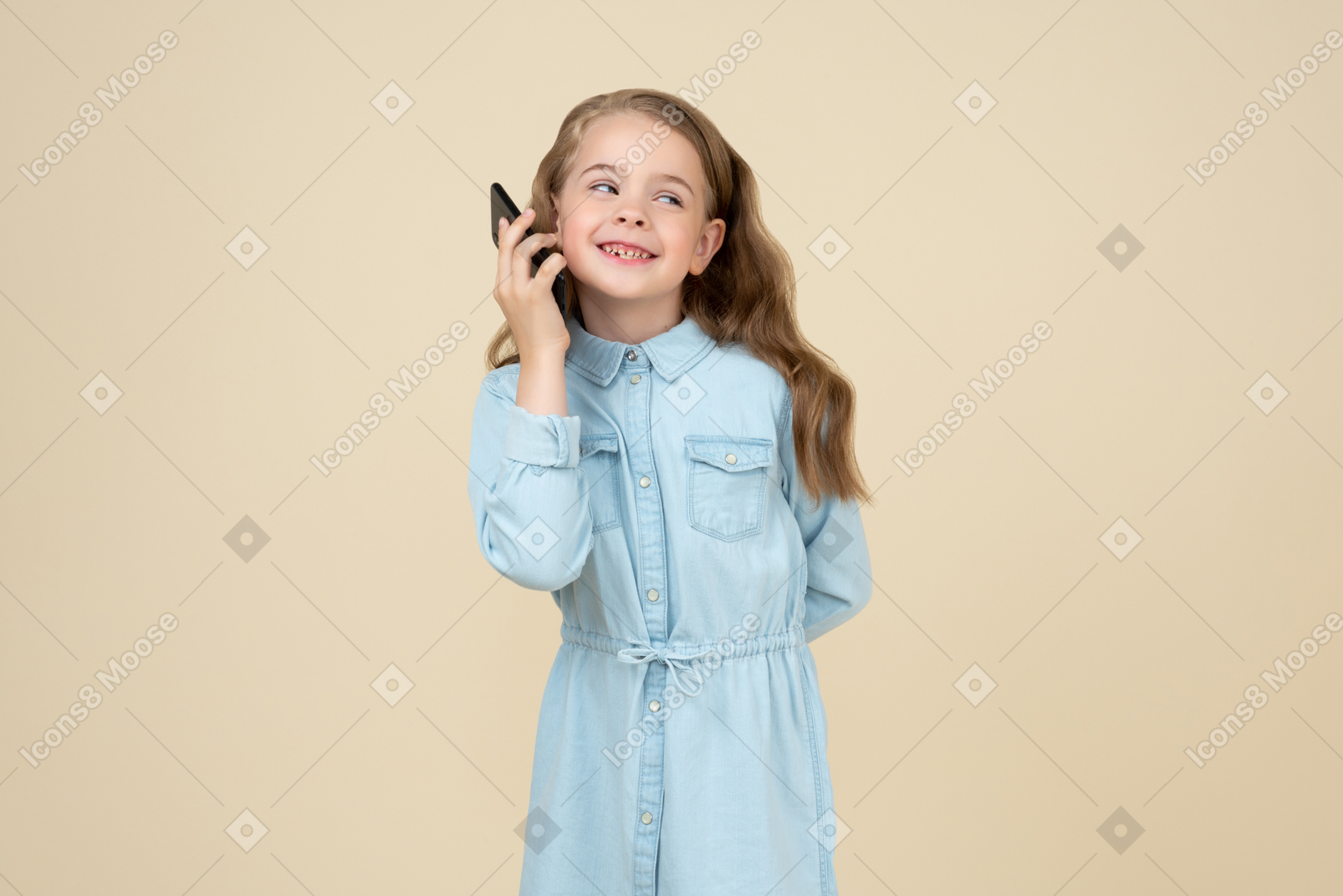 Cute little girl talking  on the phone