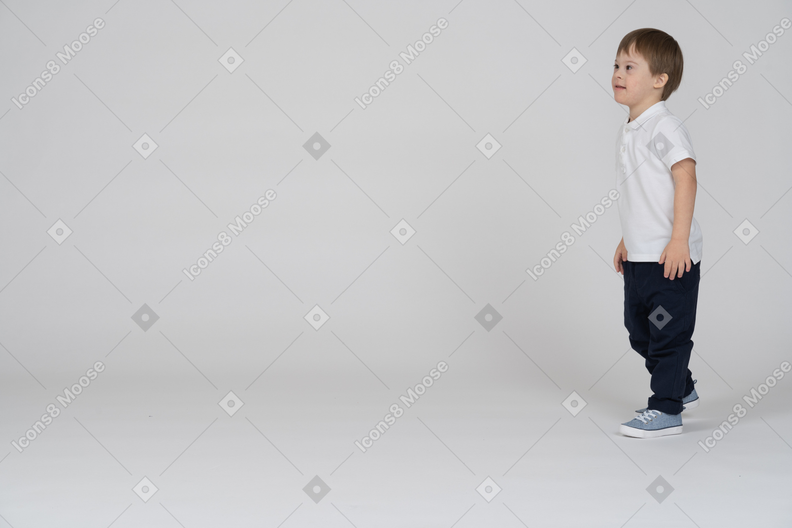 Three-quarter view of a boy walking forward