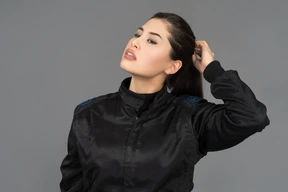 A young woman touching her hair