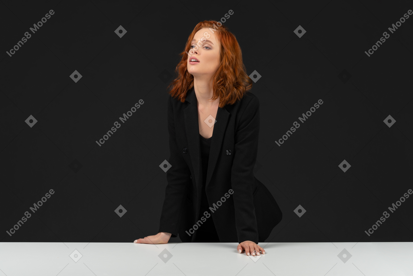A frontal view of the beautiful younf womanstanding at the table