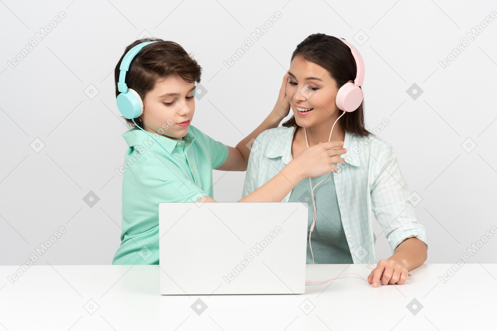 Happy mother and son listening to some musis together