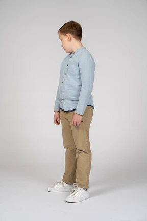 Three-quarter view of a boy looking down