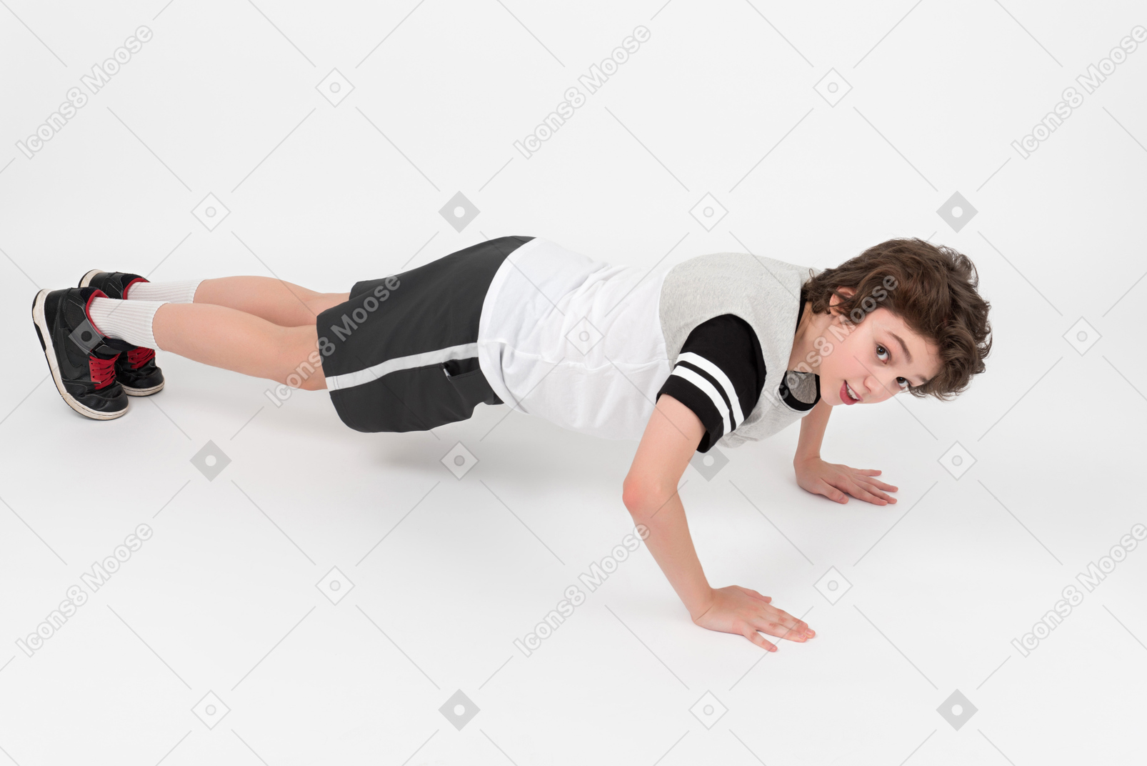 Boy focused on doing push-ups