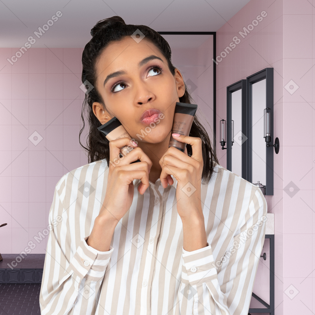 Woman choosing foundation shade in the bathroom