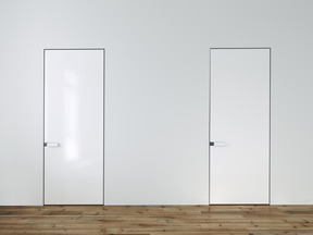 Two doors on a white wall