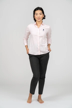 Female office worker posing with hands on hips