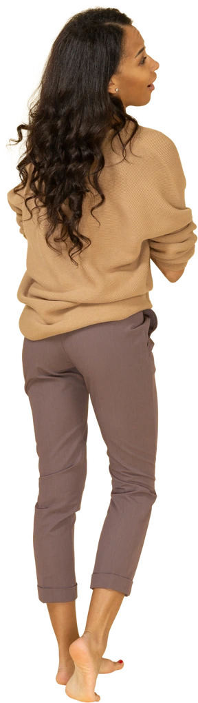 Back view of a pleased dark-skinned young female holding hands together