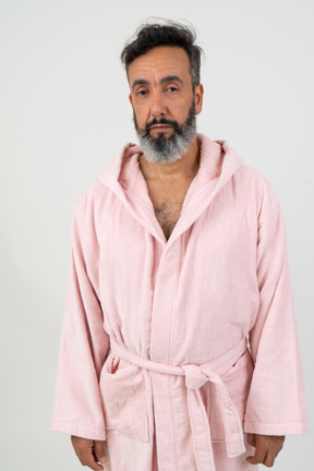 Mature man in pink robe