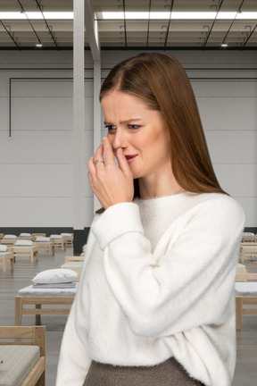 A woman is crying on a hospital background