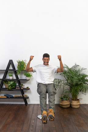 Good looking young man sitting on a chair