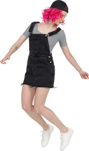 A teenage girl jumping up