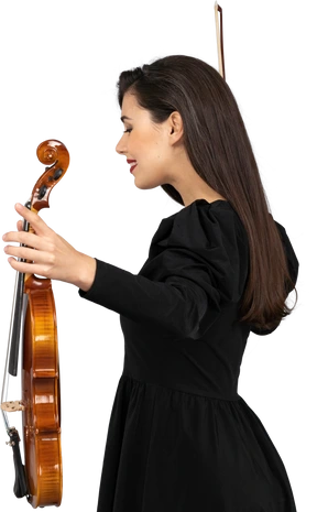 Side view of a female violin player in black dress outspreading hands