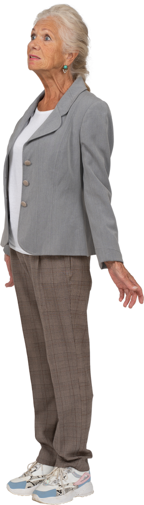 Old woman in suit posing in profile