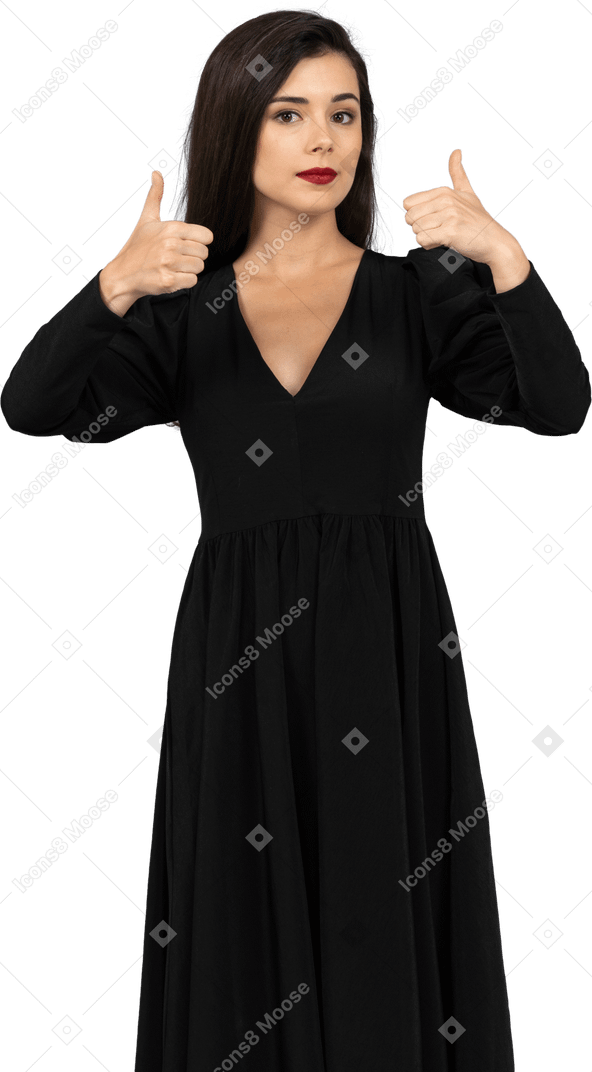 Вид спереди молодой леди в черном платье показывает палец вверх