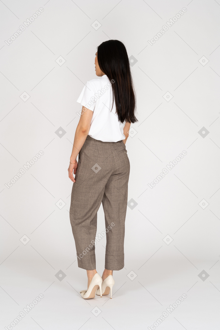 Back view of a young woman in breeches