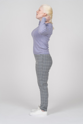 Side view of a woman raising her hands while speaking