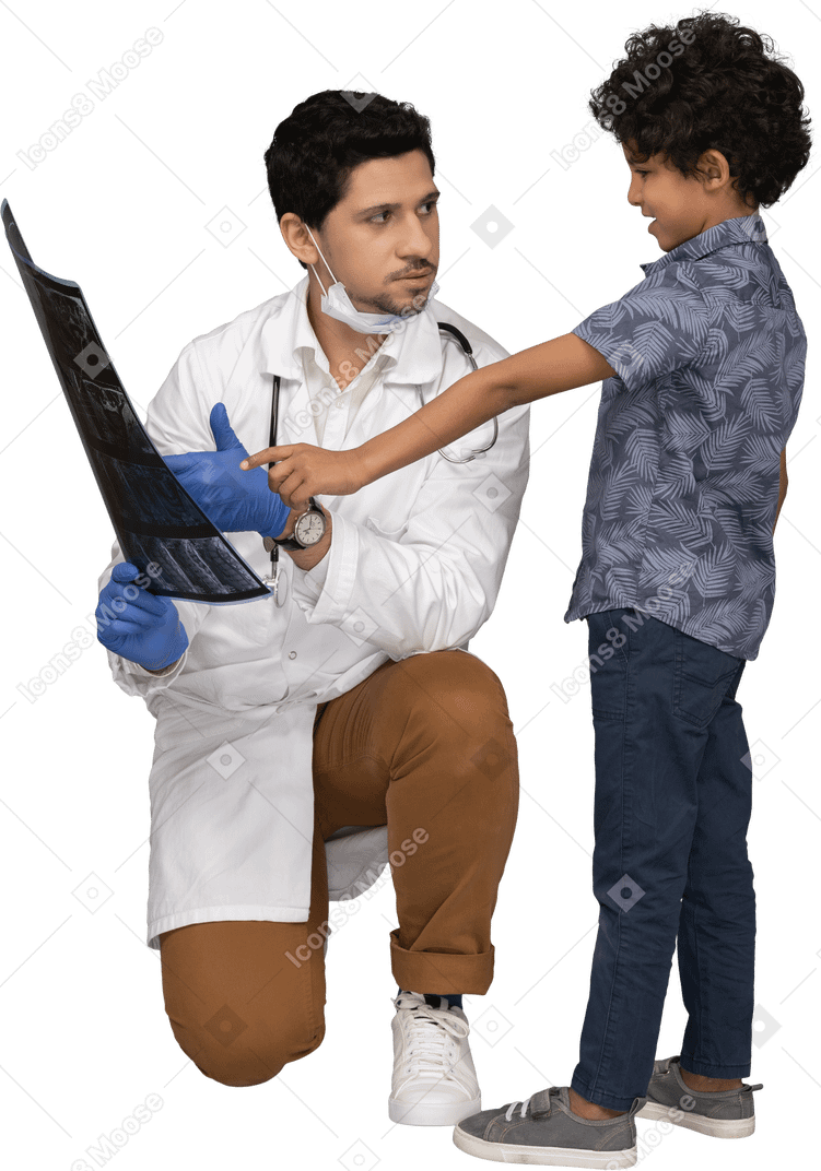 Doctor showing boy x-ray photograph