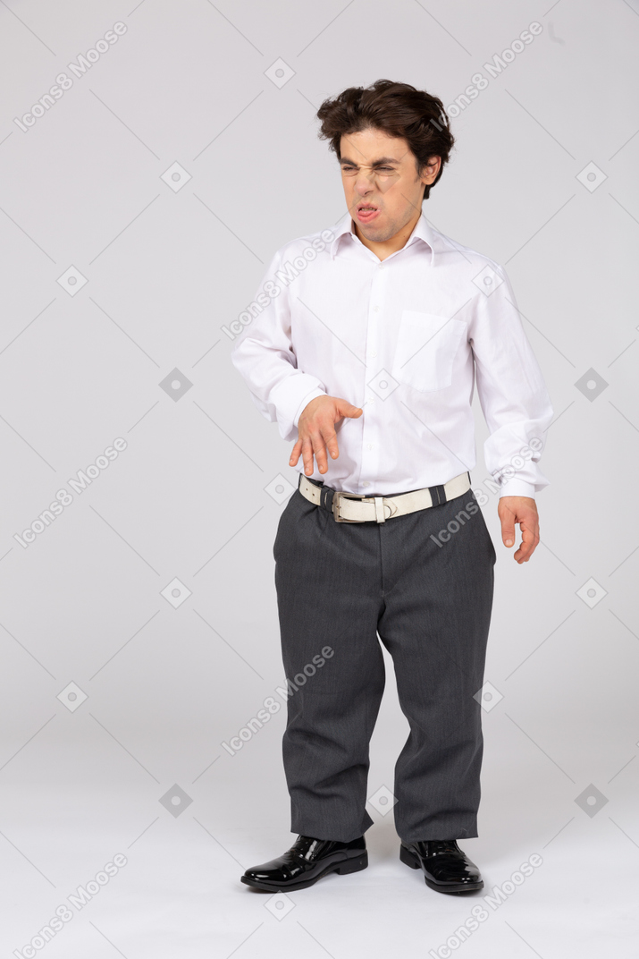 Man in business casual clothes looking disgusted