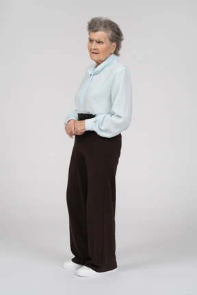 Three-quarter view of an old woman frowning with concern