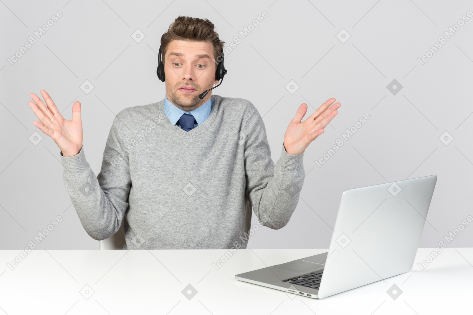 Call center agent sitting at the table and not understanding something