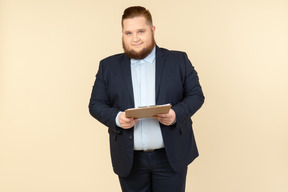 Overweight male office worker holding folder