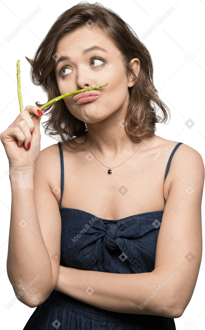 Funny girl with asparagus