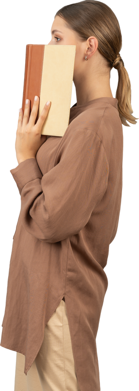 Woman covering her face in profile