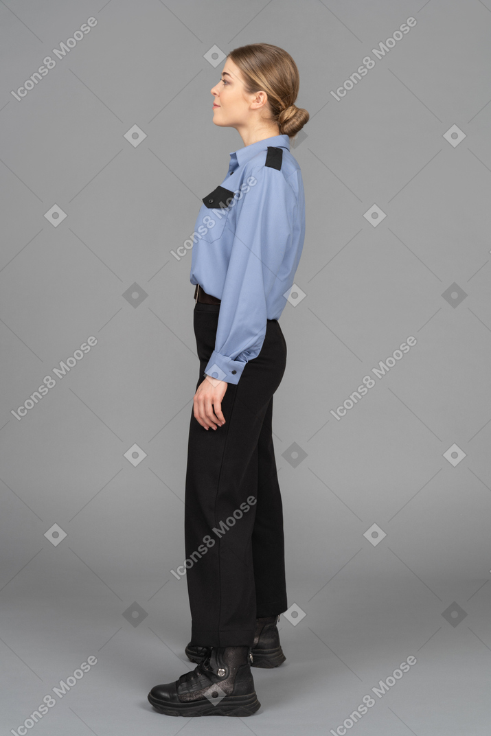 Female security guard standing in profile