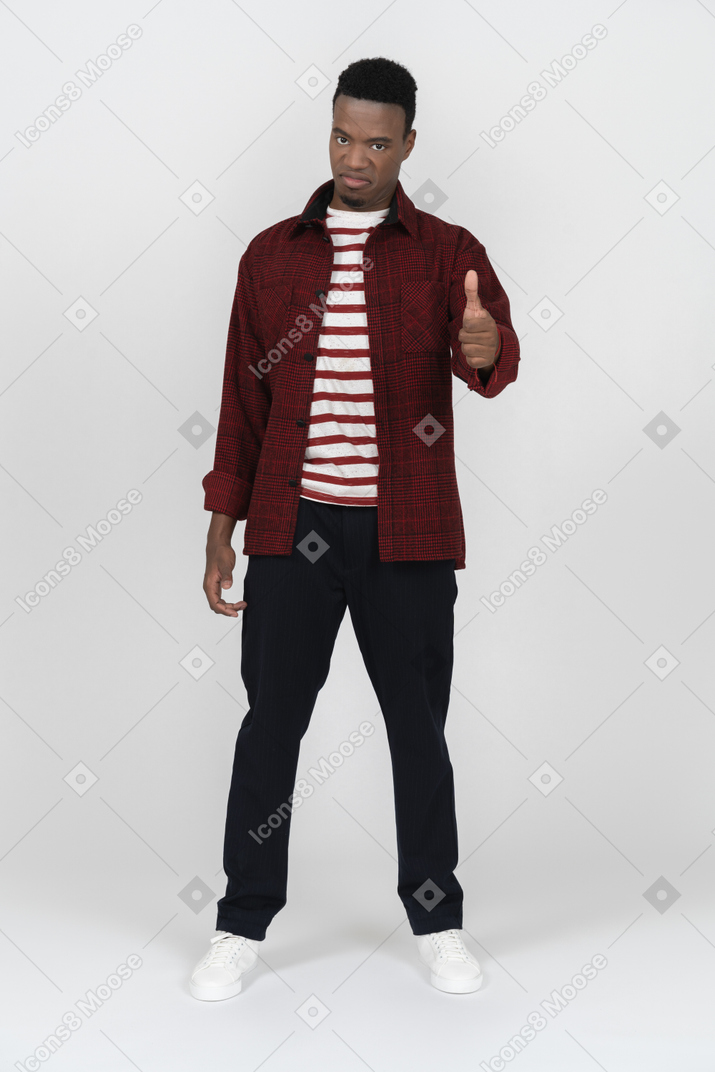 Young man giving thumbs up