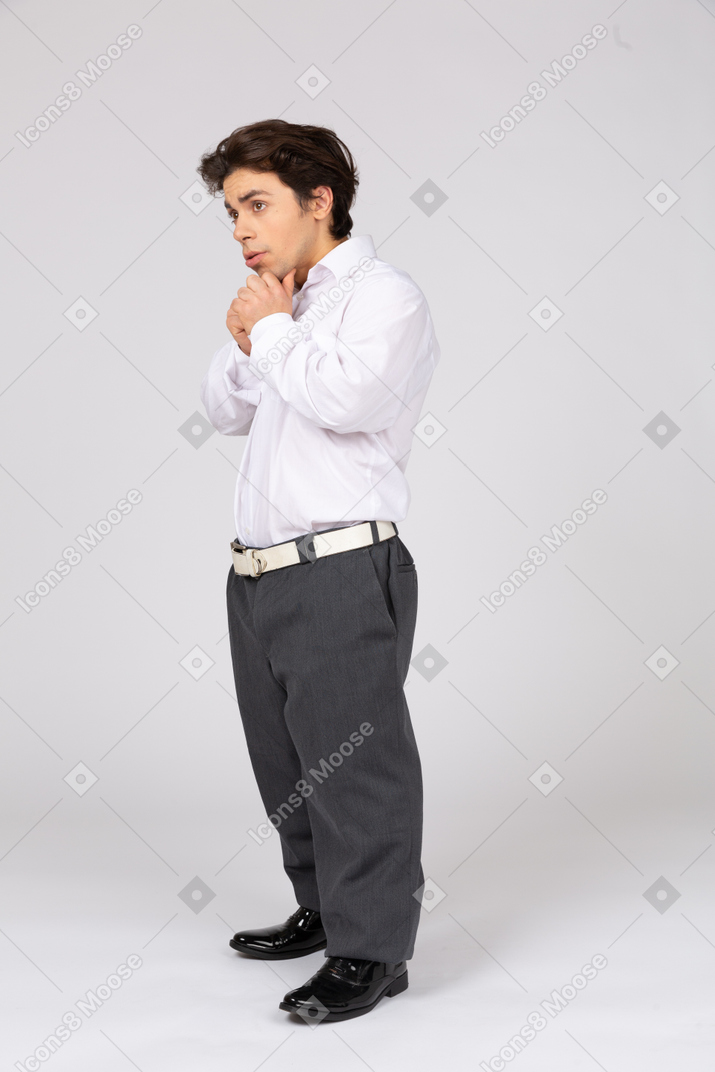 Worried young man with folded hands