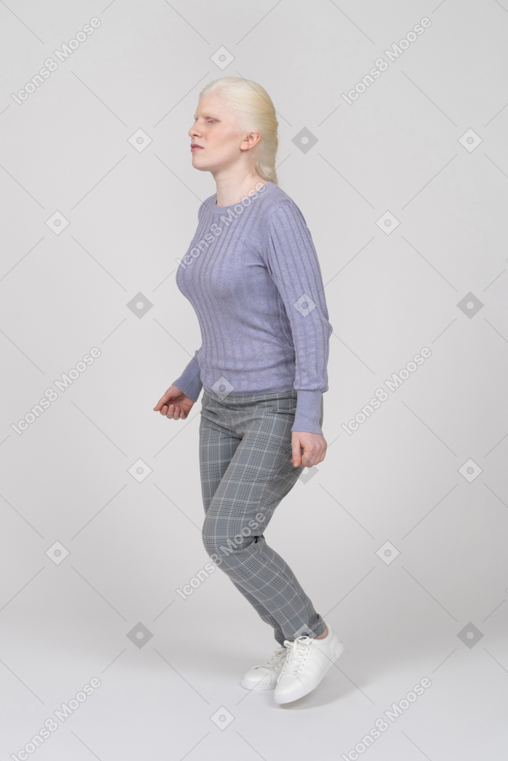 Young woman running left