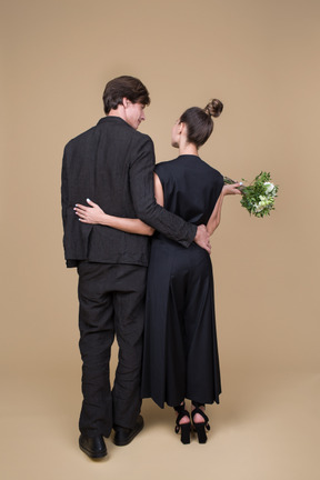 Back view of a young couple on their engagement day
