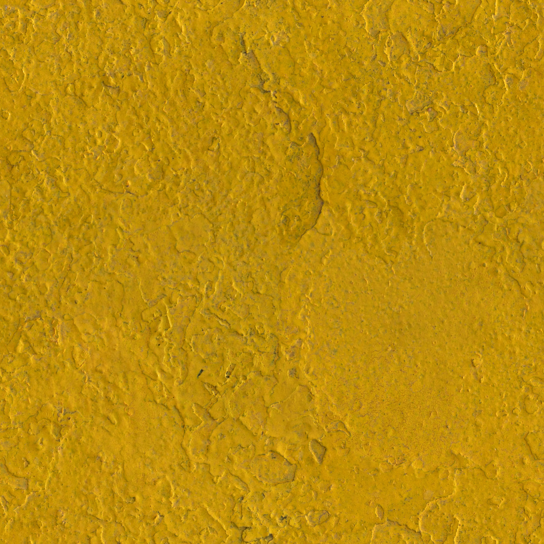 Yellow painted metal surface