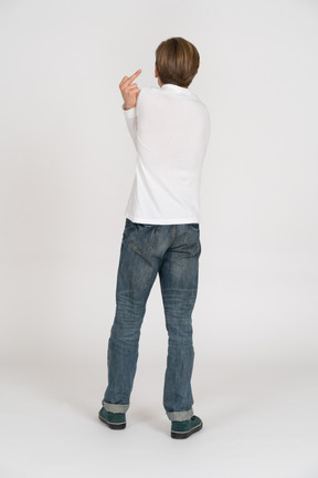 Young man in casual clothes standing