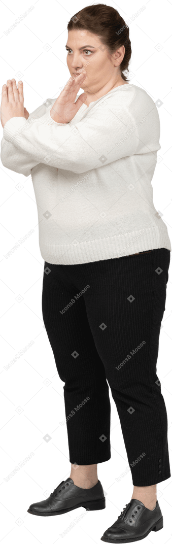 Plump woman in casual clothes making no gesture