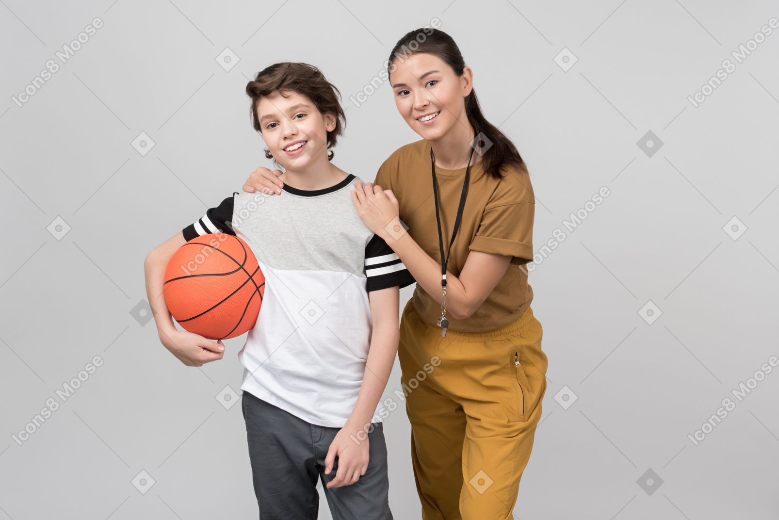 Physical education teacher holding hands in his pupil's shoulder