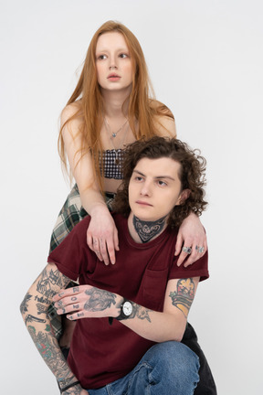 Teenage girl and boy posing together