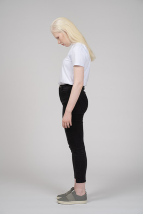 Side view of a teenage girl with her head down