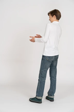 Young man in casual clothes standing