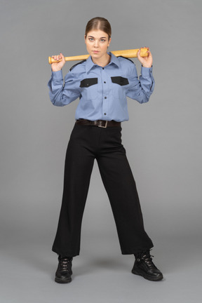 Female security guard holding a baseball bat