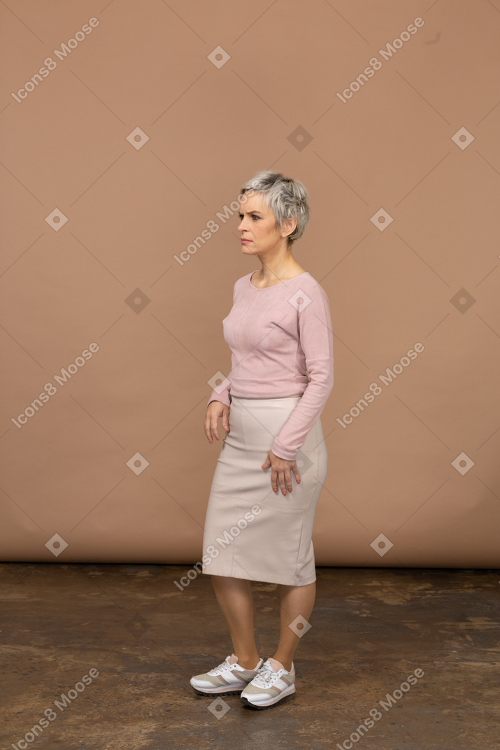 Woman in casual clothes posing in profile