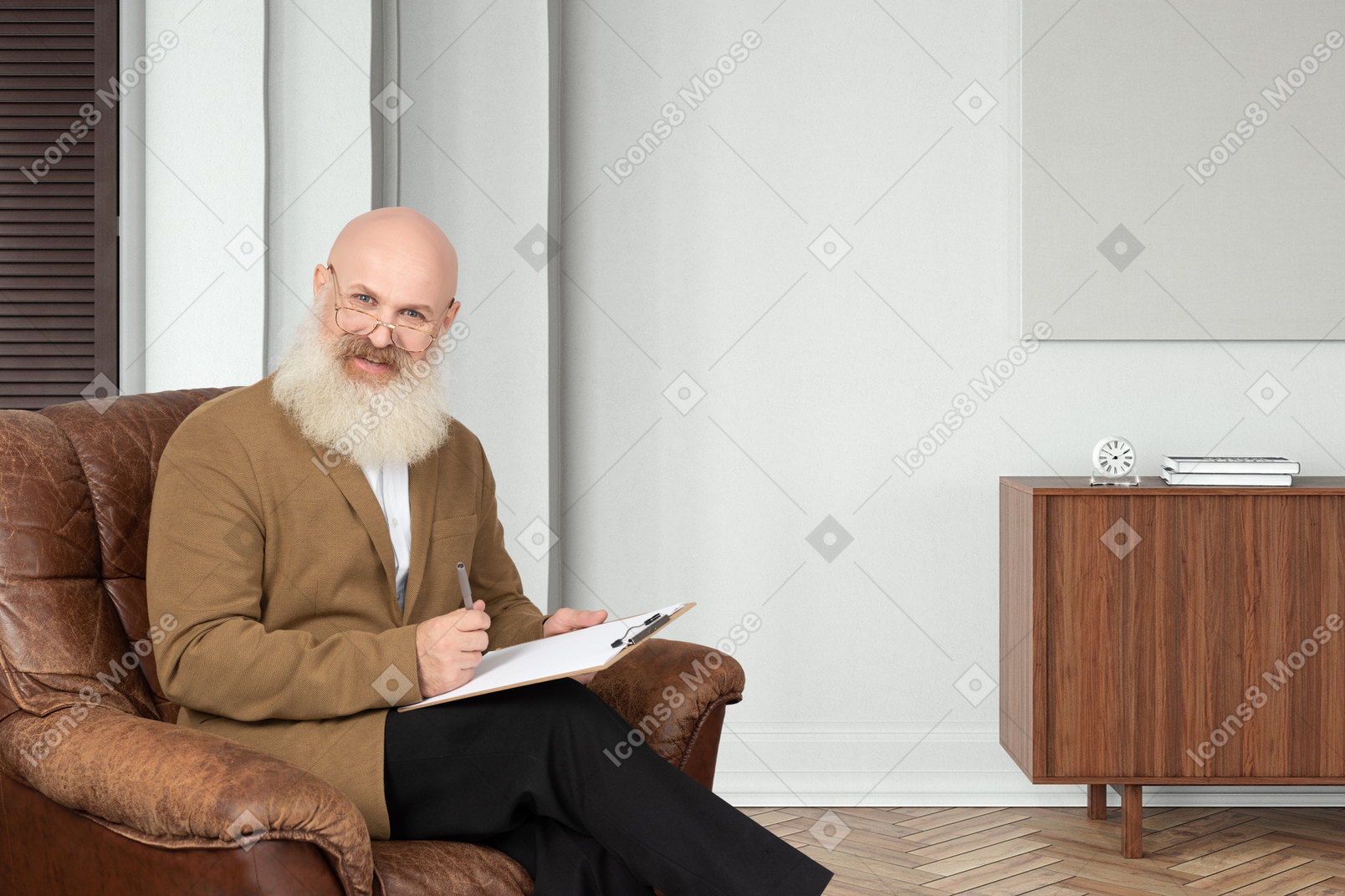 A man with a beard sitting in a chair and writing on a clipboard