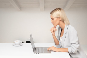 Young business woman working on laptop