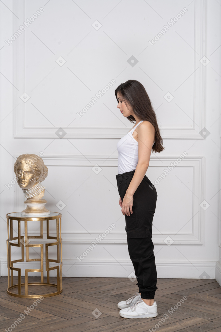 Side view of a woman with her head down