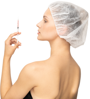 Side view of a woman holding syringe